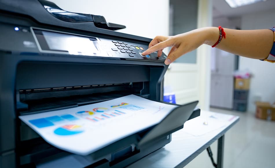Office worker printing on a commercial printer