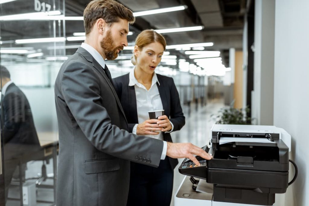 man and woman are checking Print Security 