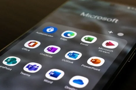 a close-up of a cell phone with the essential office tools apps for students