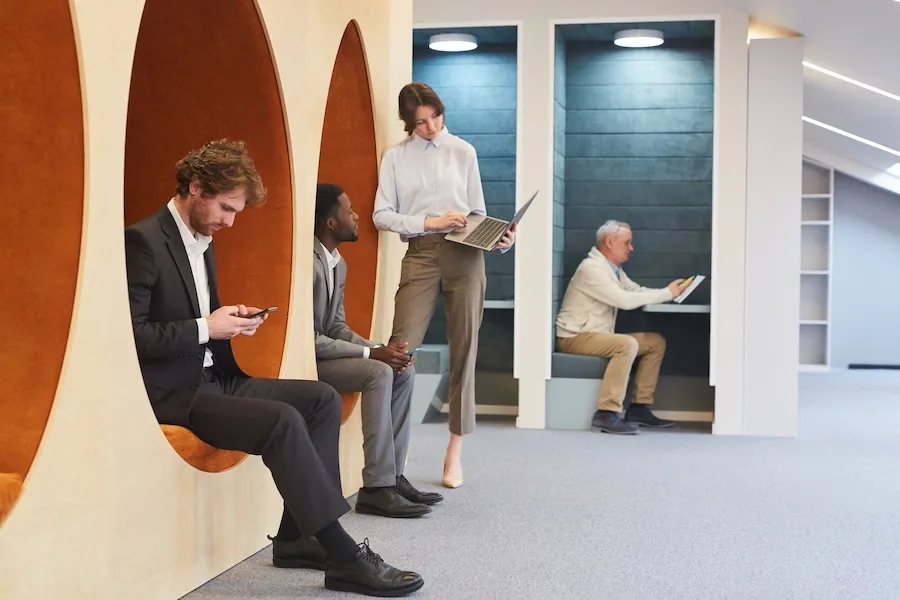 a group of people sitting in a flexible workspaces